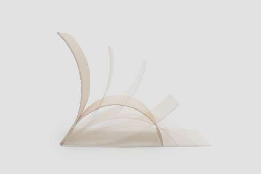 Image 1: Stages of the self-forming process: air drying shapes the flat, compact configuration into the stable, curved geometry of a comfortable chair. Photo: University of Stuttgart / ICD, Robert Faulkner.